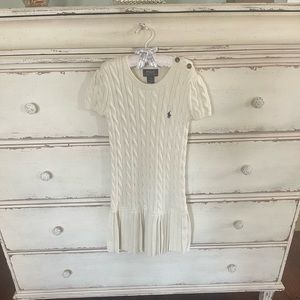 Cream Polo sweater dress with pleats.